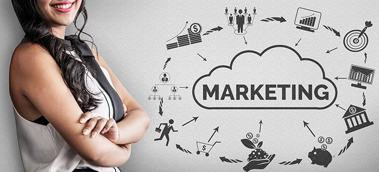 Woman standing next to wall with marketing symbols on it, Marketing inside a cloud concept, smiling woman